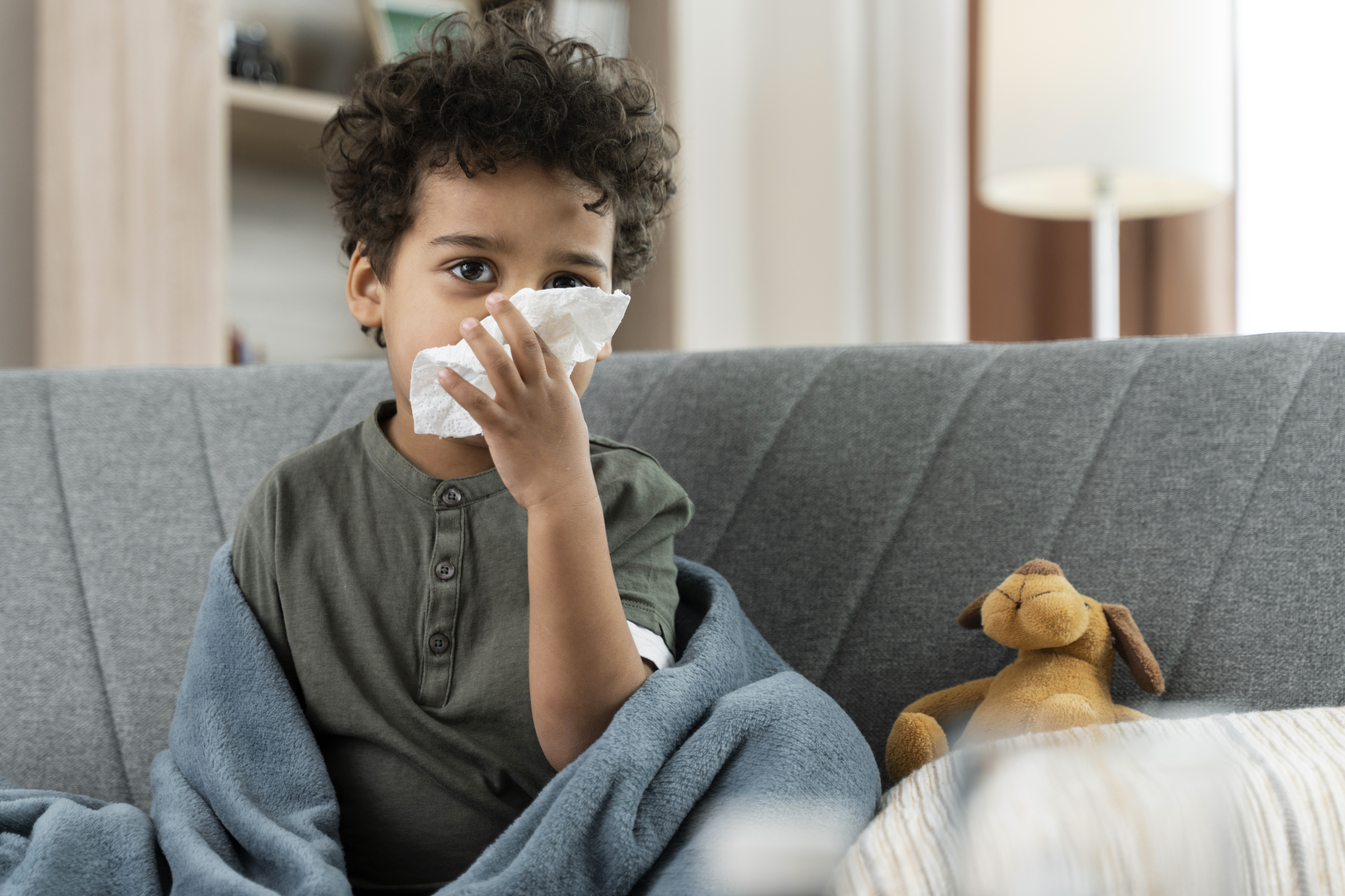 sick-boy-with-tissue