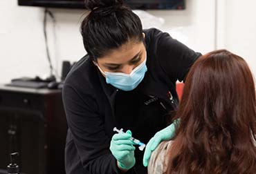 Nurse administering COVID-19 vaccine